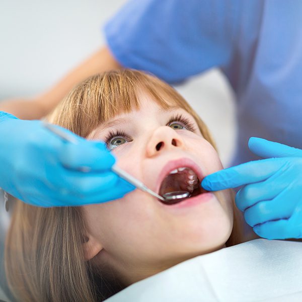 Female dentist and child in a dentist office